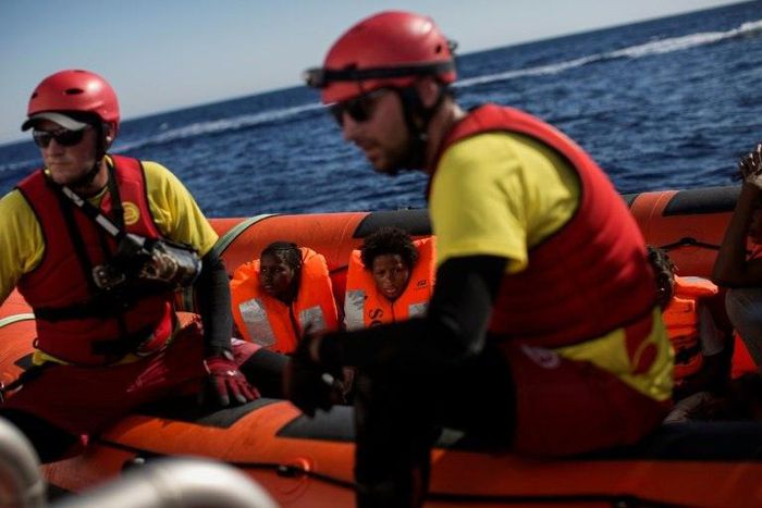 Migrants aboard a Proactiva Open Arms NGO boat following an operation in the Mediterranean Sea