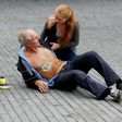 A woman gives a demonstration of an ambulance drone with built in defibrillator at the campus of the Delft Technical University in Delft on October 28, 2014. A Swedish report Tuesday said drones can drastically cut response times for delivering the lif...