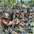 Moro Islamic Liberation Front (MILF) rebels gather inside their camp, as thousands of its members and residents arrive for a rally in support of the peace in 2014