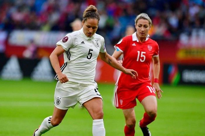 Germany's defender Babett Peter (L) scored during the women's Euro game against Denmark, setting her team up for a 2-0 victory and a spot in the quarter-finals