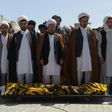 Distraught relatives and friends carried coffins into the cemetery one by one, a day after the latest deadly attack claimed by the Islamic State group on Afghanistan's reeling minority Shiite community