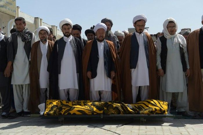 Distraught relatives and friends carried coffins into the cemetery one by one, a day after the latest deadly attack claimed by the Islamic State group on Afghanistan's reeling minority Shiite community