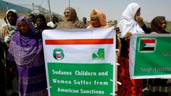Sudanese representatives of various humanitarian organisations take part in a protest outside the US embassy in Khartoum on September 16, 2015, against the sanctions imposed on the country