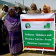 Sudanese representatives of various humanitarian organisations take part in a protest outside the US embassy in Khartoum on September 16, 2015, against the sanctions imposed on the country