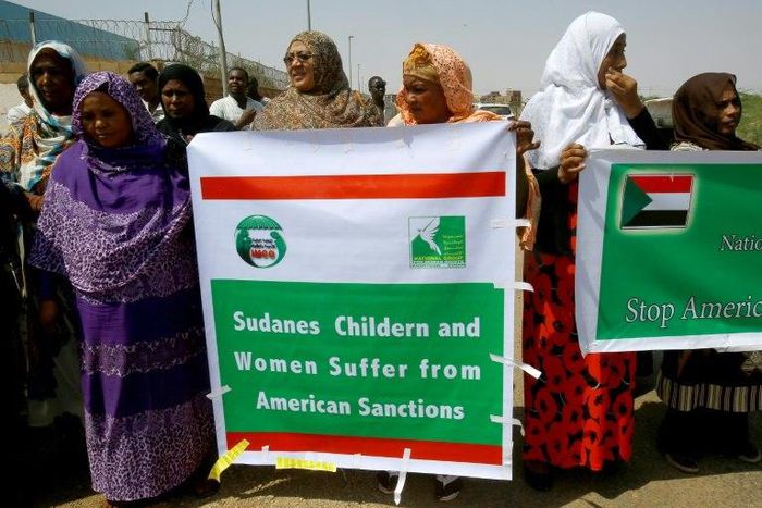 Sudanese representatives of various humanitarian organisations take part in a protest outside the US embassy in Khartoum on September 16, 2015, against the sanctions imposed on the country