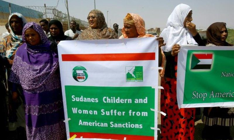 Sudanese representatives of various humanitarian organisations take part in a protest outside the US embassy in Khartoum on September 16, 2015, against the sanctions imposed on the country