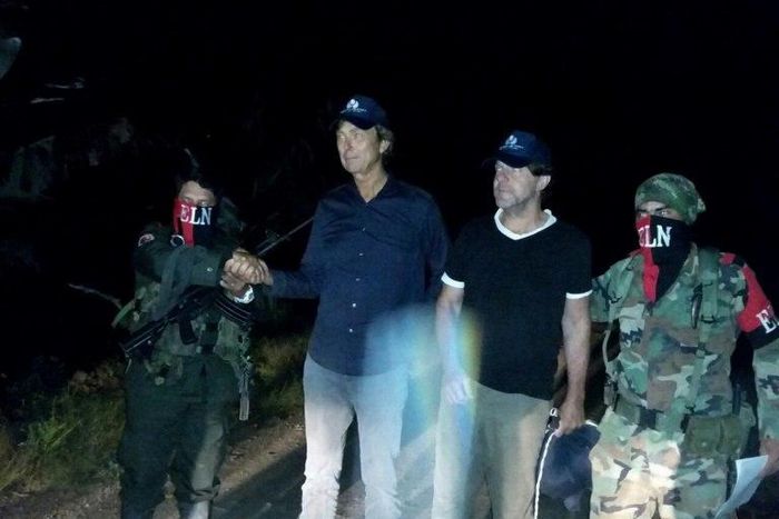 Dutch reporters Derk Johannes Bolt (2L) and Eugenio Ernest Marie Follender (2R) after their release by ELN rebels, upon arriving in Catatumbo, northeast Colombia on June 24, 2017, in an image released by the Colombian Ombudsman press office