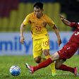 Yu Hanchao of China (L) vies for the ball with Mouaiad Al Ajjan (R) of Syria during the FIFA World Cup 2018 Group A third round qualifying match June 13, 2017