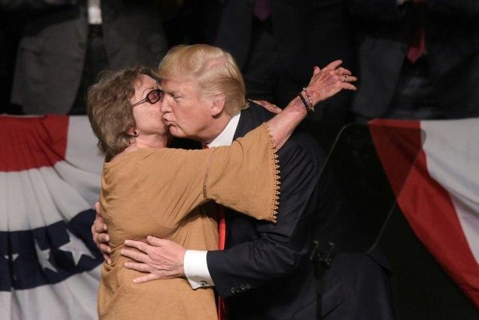US President Donald Trump hugs Cuban dissident Cary Roque as he tightens restrictions on trade and travel to the island