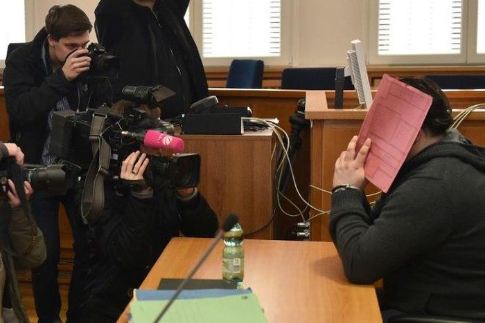 Niels Hoegel, seen hiding his face during his trial, was jailed for life in 2015 after admitting killing several patients at a hospital in northern Gemrany