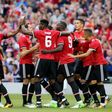 Manchester United players celebrate their first goal scored by Manchester United's Armenian midfielder Henrikh Mkhitaryan during the pre-season friendly game against Sampdoria at the Aviva stadium in Dublin on August 2, 2017