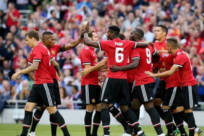 Manchester United players celebrate their first goal scored by Manchester United's Armenian midfielder Henrikh Mkhitaryan during the pre-season friendly game against Sampdoria at the Aviva stadium in Dublin on August 2, 2017