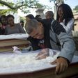 Luis Carlos de Oliveira, 49, mourns his relatives Ana Cristina da Conceicao, 42, and her mother, Marlene Maria da Conceicao, 76, killed by stray bullets during a firefight between police and traffickers in the Mangueira shantytown, in Rio de Janeiro in...