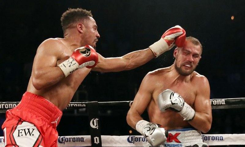 Andre Ward (L) battles Sergey Kovalev during their light heavyweight championship bout at the Mandalay Bay Events Center in Las Vegas, Nevada