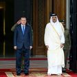 This handout photo taken and released by Turkey's Presidential Press Service on February 15, 2017 shows the Emir of Qatar Tamim bin Hamad Al Thani (R) and Turkish President Recep Tayyip Erdogan (L) attending a welcome ceremony in Doha