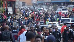Commuters walk from the Fig Tree terminus as they try to access Nairobi CBD