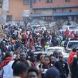 Commuters walk from the Fig Tree terminus as they try to access Nairobi CBD