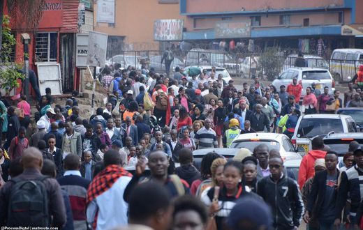 Commuters walk from the Fig Tree terminus as they try to access Nairobi CBD