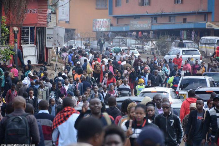 Commuters walk from the Fig Tree terminus as they try to access Nairobi CBD