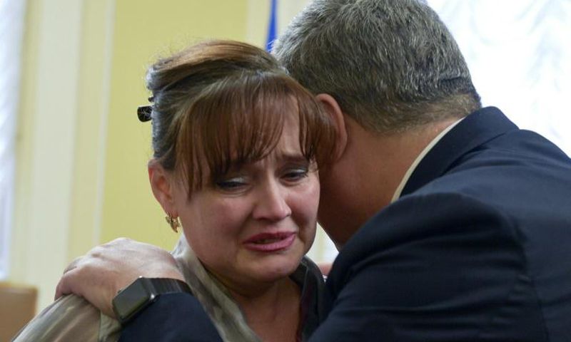 Ukrainian President Petro Poroshenko hugs a relative of one of the sailors arrested captured by Russia in one of the most dangerous incident between the two ex-Soviet neighbours in years