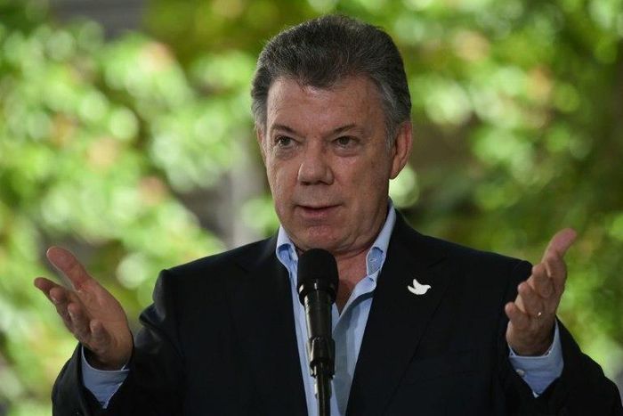 "With the laying down of arms ... the conflict is truly over and a new phase begins in the life of our nation," Colombian President Juan Manuel Santos said