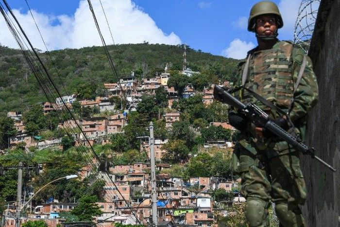 A soldier takes position at the Lins de Vasconcelos slum complex during a crackdown on crime gangs in Rio de Janeiro, Brazil, on August 5, 2017