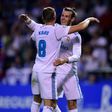 Real Madrid's midfielder Toni Kroos (C) celebrates with teammate Gareth Bale scoring on August 20, 2017