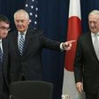 US Defense Secretary James Mattis (R) watches as US Secretary of State Rex Tillerson (C) shows the way to Japan's Foreign Minister Taro Kono ahead of the start of the US-Japan Security talks centered on North Korea