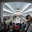 A tourist takes a selfie during a visit to a subway station in Pyongyang -- around 5,000 Western travellers visit the North each year, tour companies say