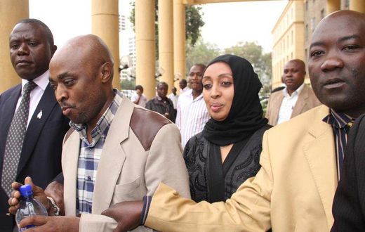 Mugo wa Wairimu being whisked away by CID officers