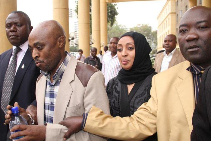 Mugo wa Wairimu being whisked away by CID officers