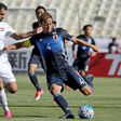 Keisuke Honda (R) of Japan fights for the ball against Iraqi Saad Abdulameer (L) during their 2018 World Cup qualifying football match June 13, 2017