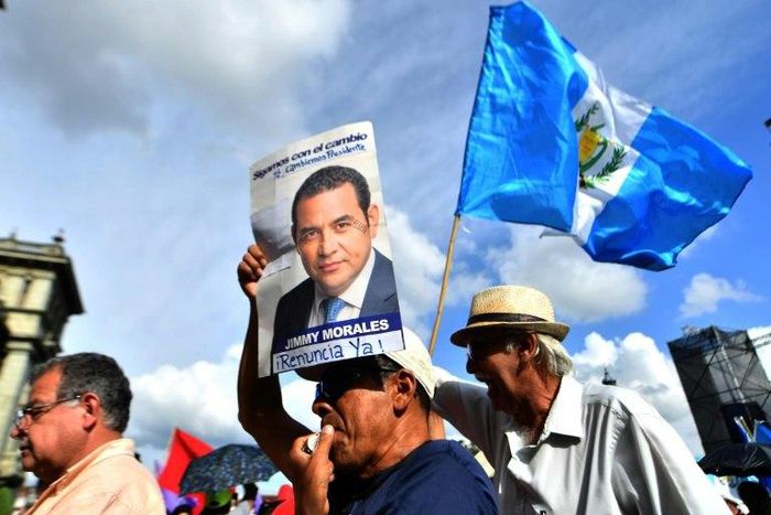 Guatemalans march demanding the resignation of President Jimmy Morales and in support of a UN anti-corruption official who moved to strip him of his immunity
