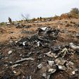 A French soldier looks at debris of the Air Algerie Flight AH 5017 in Mali's Gossi region, west of Gao on July 26, 2014