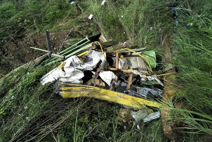 The wreckage of a bus lies in a gorge following an accident near the Indian town of Rampur on July 20, 2017