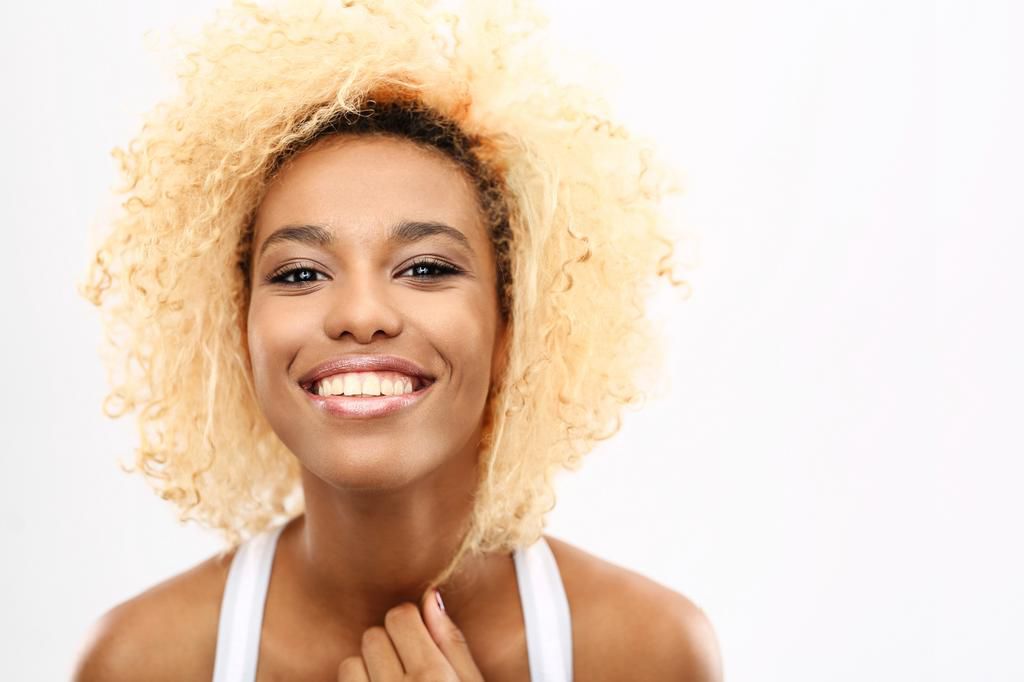 Dyed natural hair can sometimes appear dry and lacklustre [hairlovetoknow]