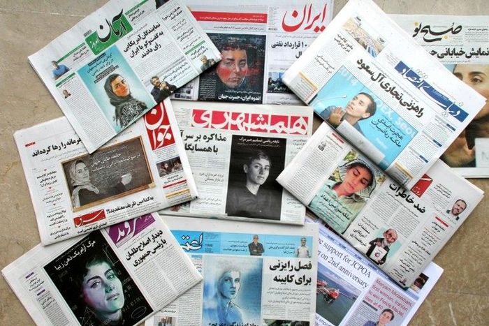 A picture taken in the capital Tehran on July 16, 2017 shows the front pages of Iranian newspapers bearing portraits of mathematician Maryam Mirzakhani, who died of cancer a day earlier