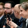 Mexican journalist Carmen Aristegui holds her mobile phone during a press conference in Mexico City, on June 19, 2017