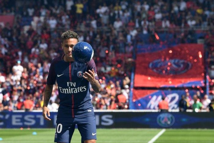 Paris Saint-Germain's forward Neymar poses during his presentation to the fans at the Parc des Princes stadium in Paris, on August 5, 2017