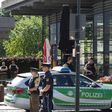 Police secure the area around a rail station near Munich where shots were fired. A female police officer was badly injured and several people were wounded