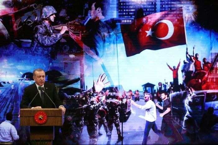 Turkish President Recep Tayyip Erdogan speaks in Ankara on July 13, 2027, during a ceremony marking the last year's failed coup