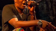 Tanzanian rapper AY on stage at a past performance