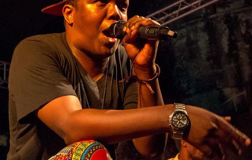 Tanzanian rapper AY on stage at a past performance