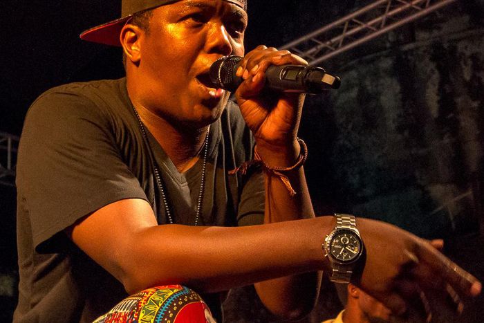 Tanzanian rapper AY on stage at a past performance