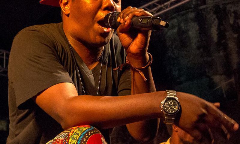 Tanzanian rapper AY on stage at a past performance