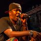 Tanzanian rapper AY on stage at a past performance