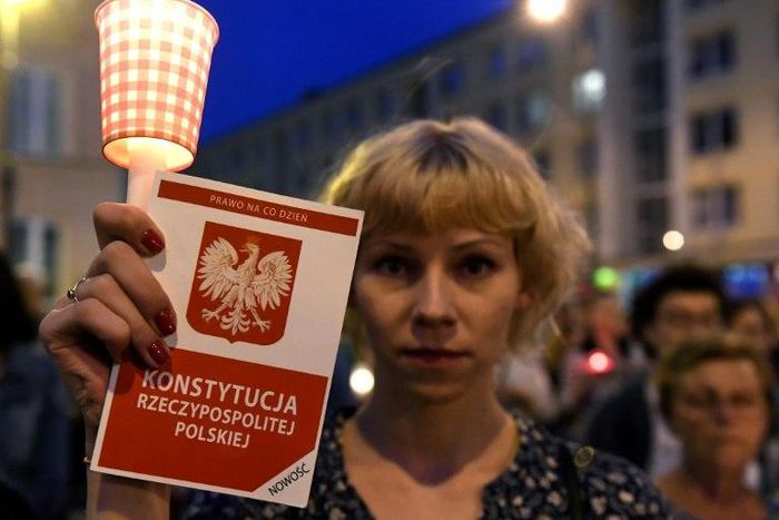 Protesters demonstrate in front of the Polish Supreme Court in Warsaw on July 23, 2017