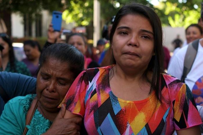 Imelda Cortez (R) was acquitted and released after being first charged with murder for giving birth prematurely in a toilet
