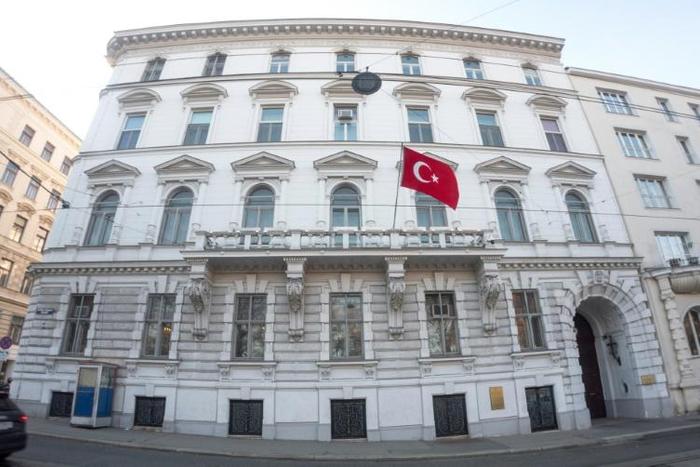A flag flutters at the Turkish embassy in Vienna, Austria, where a row over dual nationality has become a major talking point among people of Turkish origin