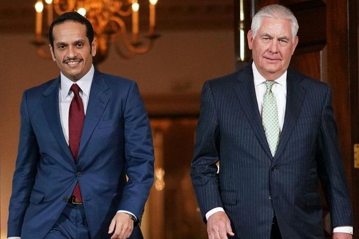 Qatari Foreign Minister Sheikh Mohammed bin Abdulrahman Al-Thani(L) heads into talks with US Secretary of State Rex Tillerson in Washington on June 27, 2017